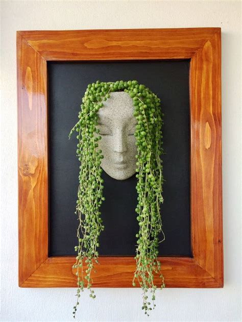 You can buy plants cheap these days at places like. Planter wall pots for plants face planter wall planter