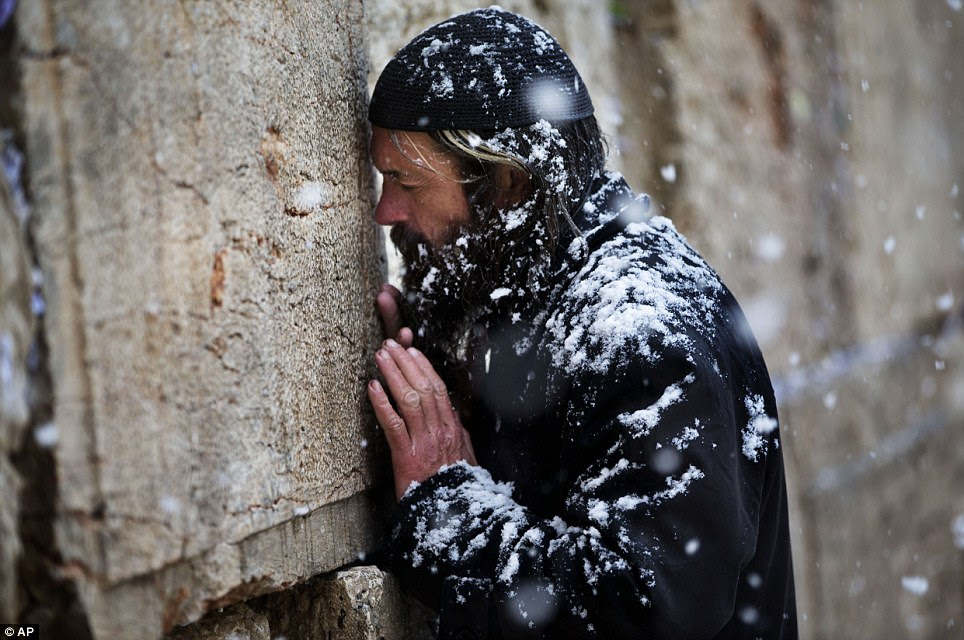 Stormy weather conditions continued in Jerusalem today with snow, torrential rains and strong winds across the region