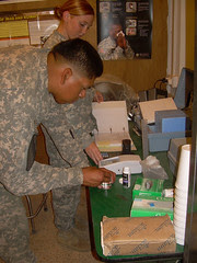 Soldiers analyze water sample.