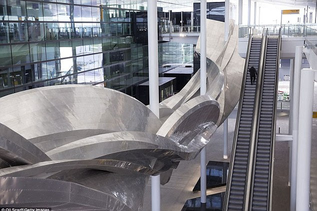 Spacious: British artist Richard Wilson's sculpture Slipstream dominates this view of the new Terminal 2
