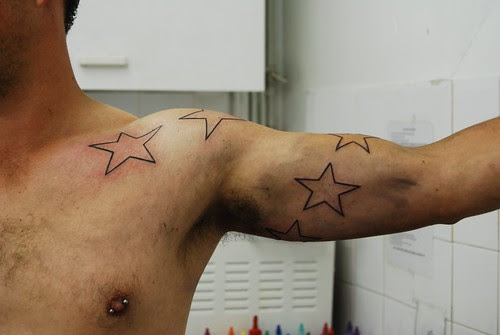  star tattoo, spiral on arm. 