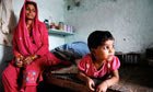 Selma Shakil, 27, with daughter Fizar, in slum in north west Delhi.  