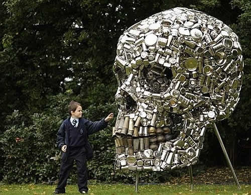 In The Air Giant Shiny Skull Crafted From Recycled Kitchen Utensils