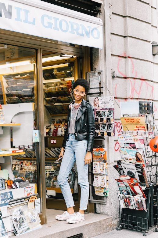 Le Fashion Blog MFW Clear Frame Glasses Leather Jacket Graphic T Shirt Cropped Jeans White Sneakers Via Collage Vintage 