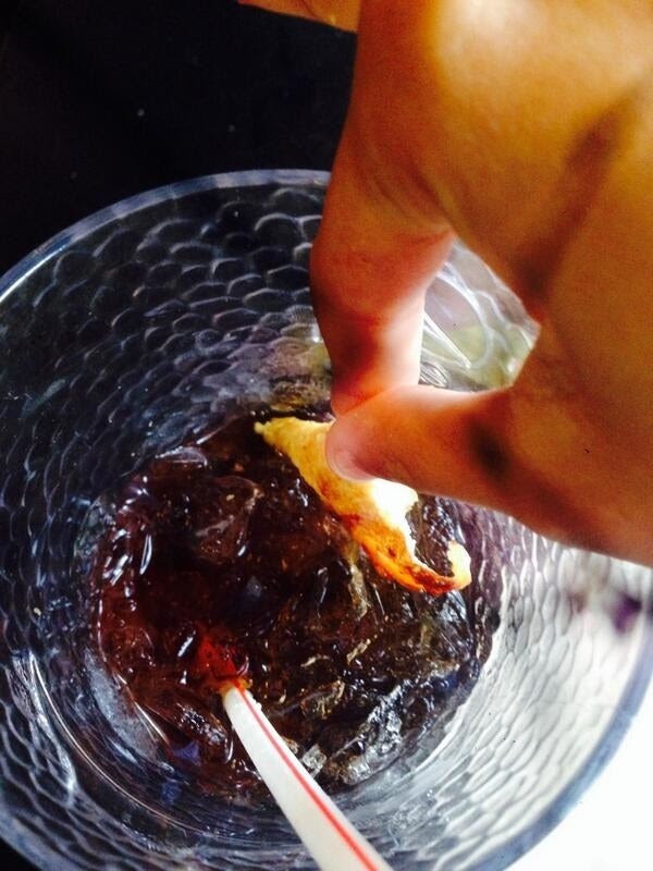 Pizza crust dipped in Diet Coke
