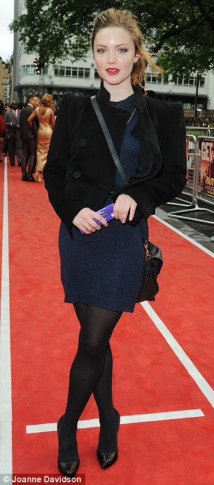 Young ladies: Actress Holliday Grainger wore a black jacket and tights while Hannah Frankson wore a silver grey dress and chunky shoes (R)