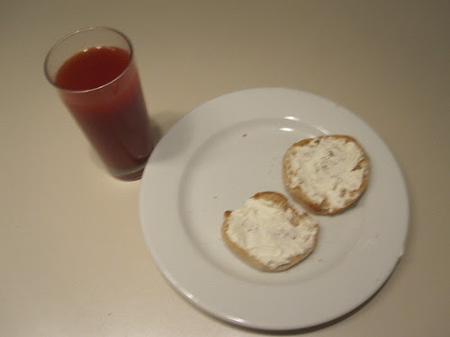 English muffin with cream cheese, tomato juice