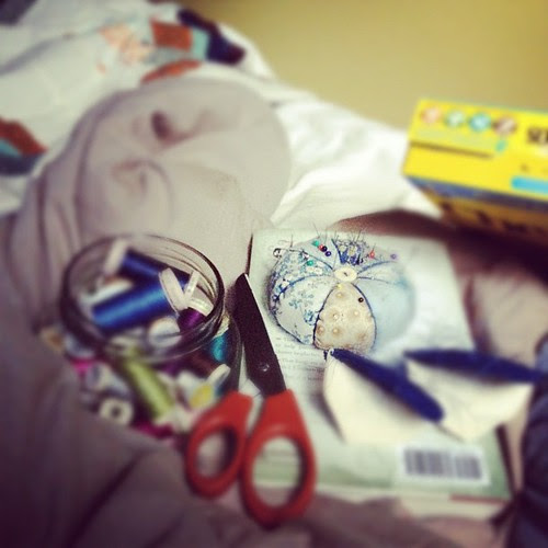 Power's out, wild and wet outside. Stitching in bed sounds good.