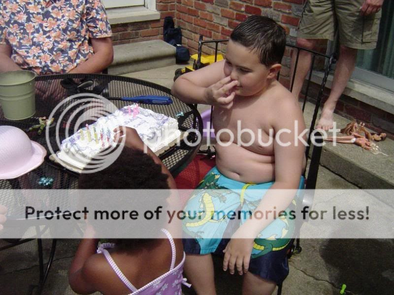 He's picking his nose!