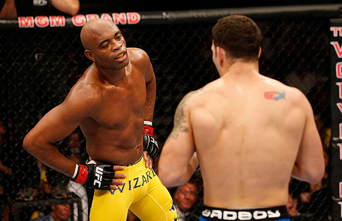 LAS VEGAS, NV - JULY 06:  Anderson Silva (left) taunts Chris Weidman in their UFC middleweight championship fight during the UFC 162 event inside the MGM Grand Garden Arena on July 6, 2013 in Las Vegas, Nevada.  (Photo by Josh Hedges/Zuffa LLC/Zuffa LLC via Getty Images) *** Local Caption *** Anderson Silva; Chris Weidman