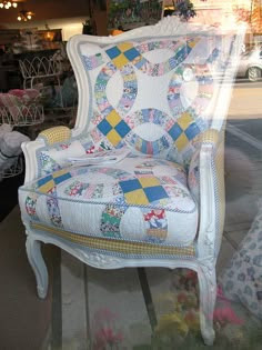 Quilt upholstered vintage chair.  Seen in the window of a Michigan Shop "Patricia Wood & Company" Harbor Springs, Michigan