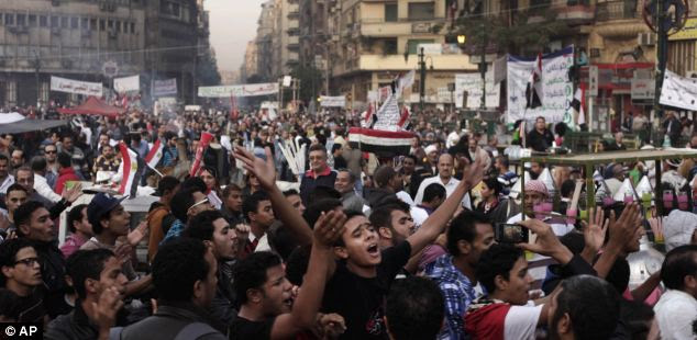 Protest: liberal opponents of President Morsi took to the streets yesterday angry at his decision to grant himself sweeping new powers