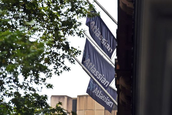 This photo taken on December 8, 2015 shows flags adorning the head office of Australian tech start-up Atlassian .