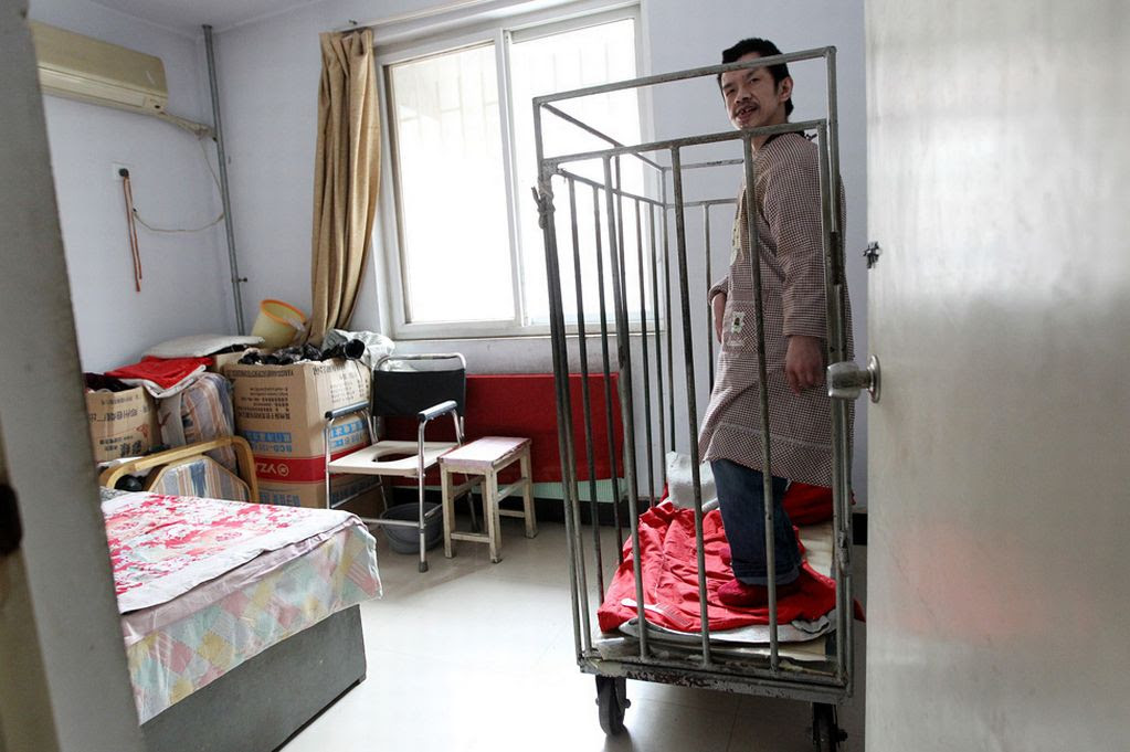 Man locked in cage for over 40 years, Zhengzhou, Henan Province, China - 10 Dec 2013