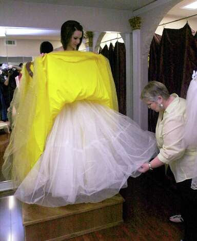 ... ball gown she was about to be photographed in. Dave Ryan/The