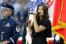 Idina Menzel sings the national anthem before the NFL Super Bowl XLIX football game between the Seattle Seahawks and the New England Patriots Sunday, Feb. 1, 2015, in Glendale, Ariz. (AP Photo/Michael Conroy)