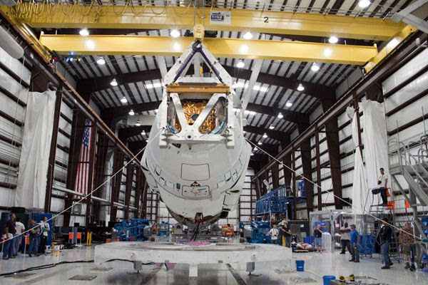 The Dragon C2+ spacecraft is about to be re-mated with its Falcon 9 launch vehicle on April 26, 2012.