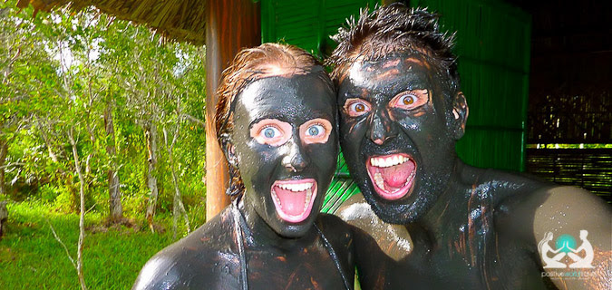 Boyfriend and girlfriend covered in mud overseas exploring the world together as a pair