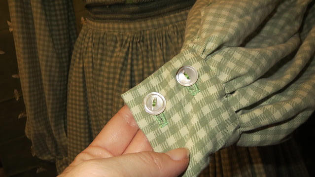 mother of pearl buttons on sleeves