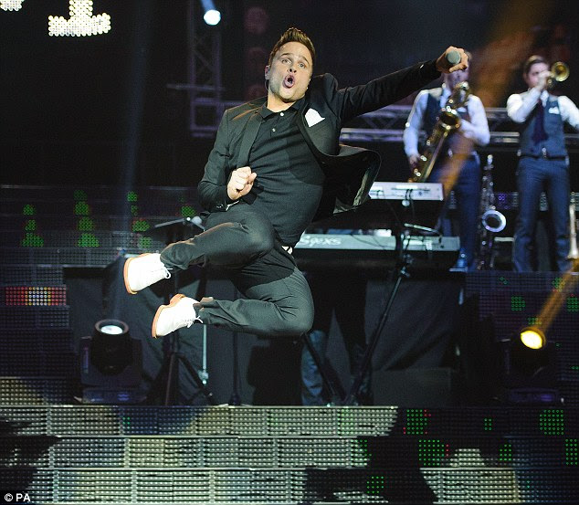 Jump for joy: Olly Murs showed off his dance moves on stage in London on Friday evening 