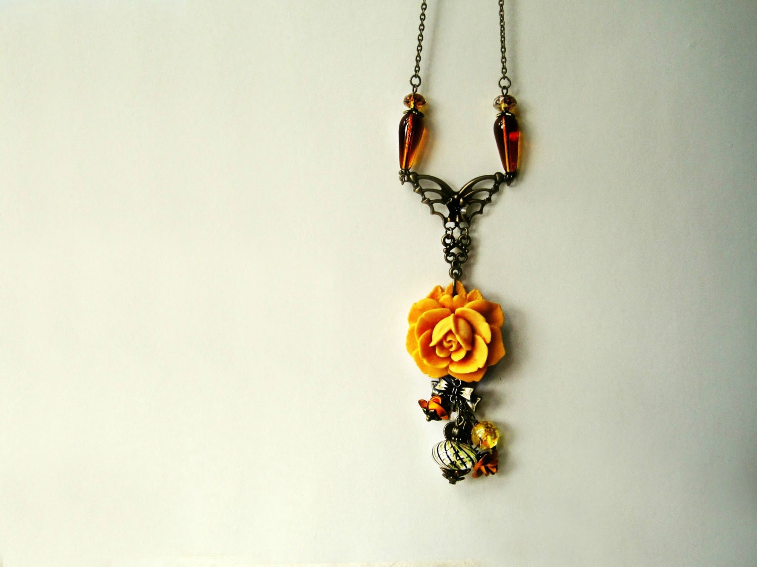 Golden Yellow Flower Charm Necklace. Handmade Spring Jewelry with Resin Marigold, Blown Amber Glass, Butterfly, Bow, and Heart Charms. - PiggleAndPop