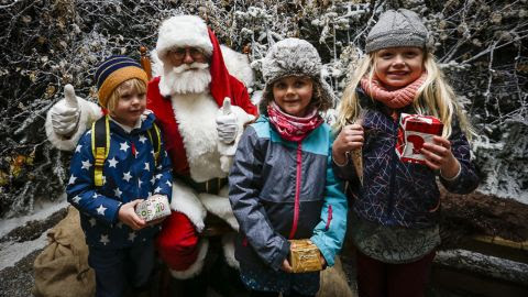Three children and Santa Claus
