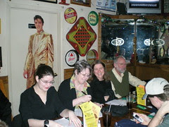 Susan signing autographs - What's Elvis doing behind her ?