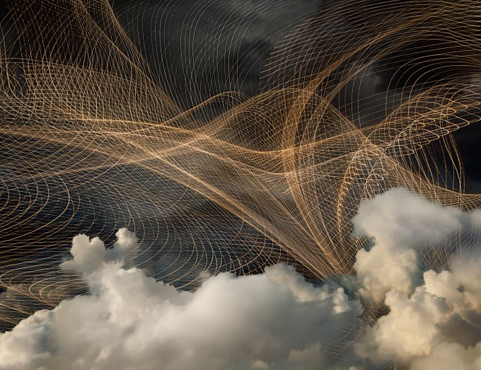 Network of light streams in cloudy sky