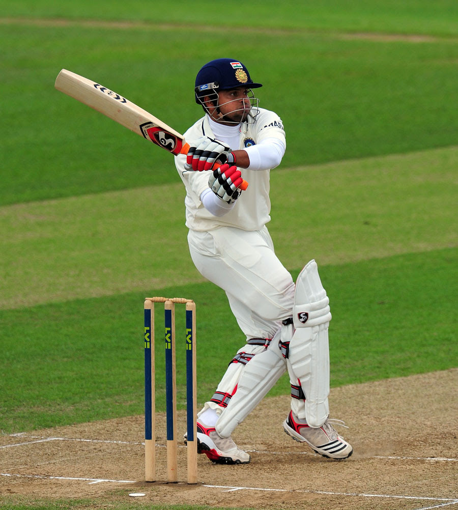 Suresh Raina watches the ball after playing a pull shot