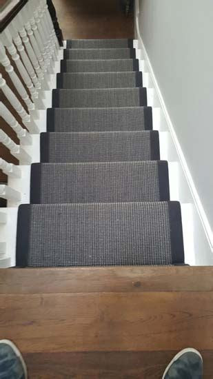 black carpet runner  black border  stairs