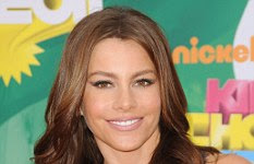 The vivacious 38-year-old said she toned down her naturally blonde look as the 'big boobs and big mouth' were too much. 