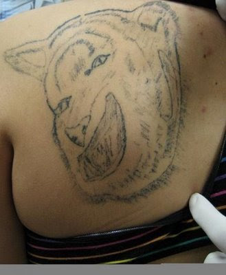 arowana tattoo. tattoo de letras