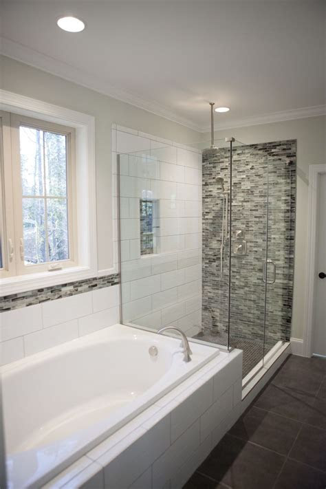 Follow these steps to remove bathroom cabinets. Custom tile accent wall in corner shower by Lawrence Homes