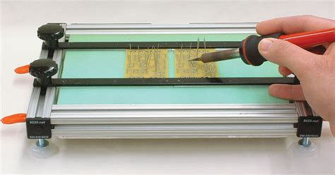 In the first photo, the plastic bar is being simulated by a pencil, and you can see how it pushes the contacts apart: Build A Circuit Board Assembly Jig | Nuts & Volts Magazine