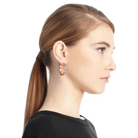 Simple yet full of style, these michael kors rose gold tone pavé stud earrings are the missing piece to your jewellery box. COACH Spike Hoop Earrings in Metallic - Lyst