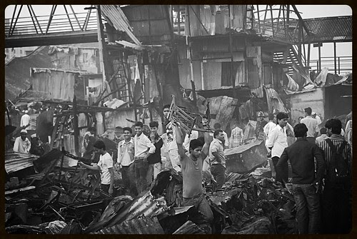 When Tragedy Takes Place .. The Bhangarwala Bhaiyya Is Not Far Away..To Carry Your Burnt Out Goods Away by firoze shakir photographerno1
