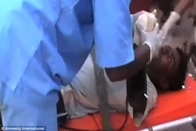 Instilling fear: Residents told Amnesty that the amputated hand was later suspended by a rope in the town's market for all to see