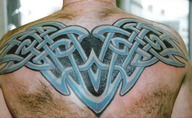 this is a big coverup of a big old tattoo, irish celtic knotwork tattoo with 