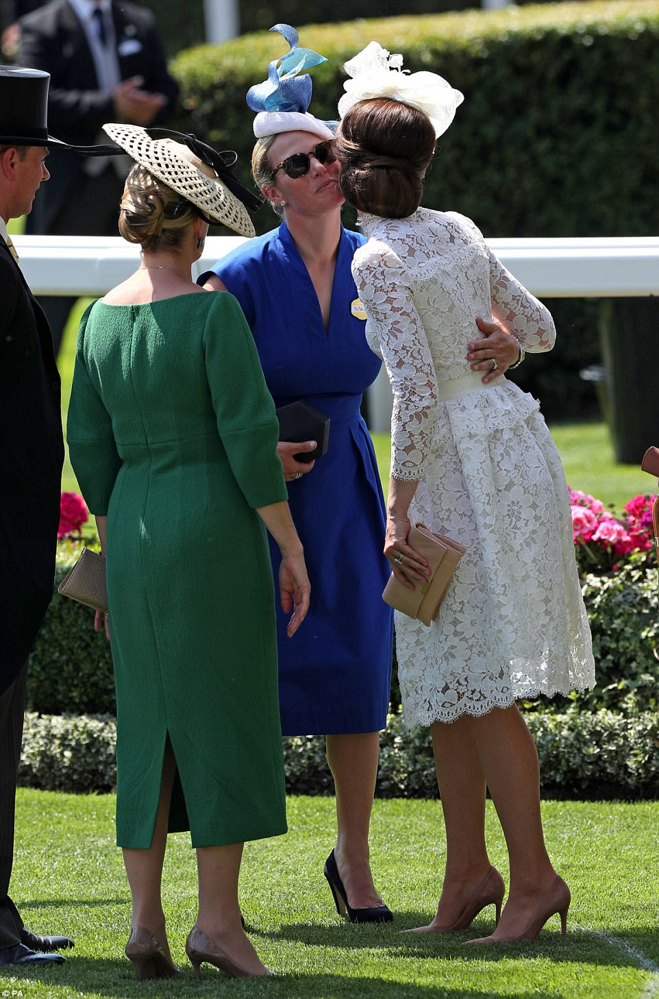 Kate gets a warm welcome from Zara Tindall who is godmother to her son Prince George 