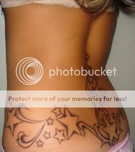 Sexy girl with a tattoo design of stars on the lower back and waist line