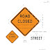 Orange Sign Indicates : What are the colors of the warning signs that indicate hazards ahead such as curves?