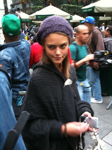 Holding pose despite paparazzi frenzy behind her
