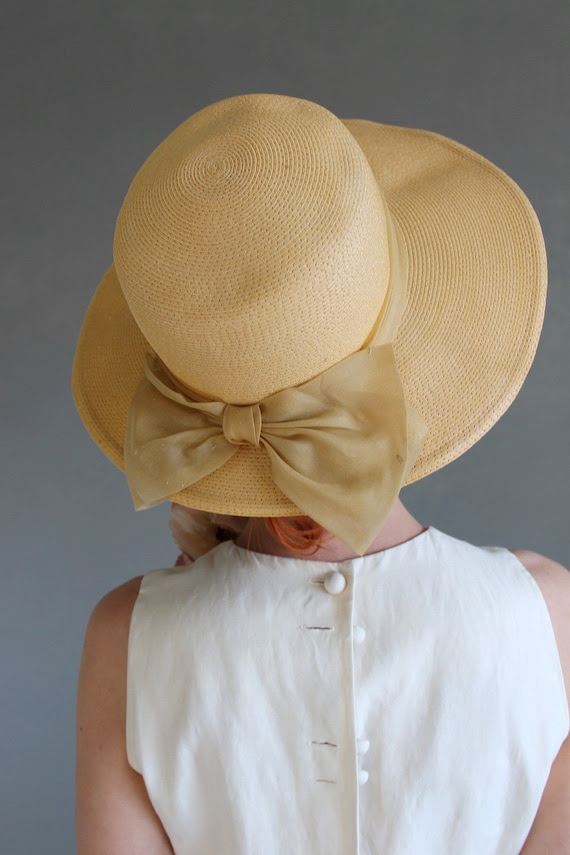 vintage straw hat by GoGoVintage yellow woven vintage hat with bow and wide brim