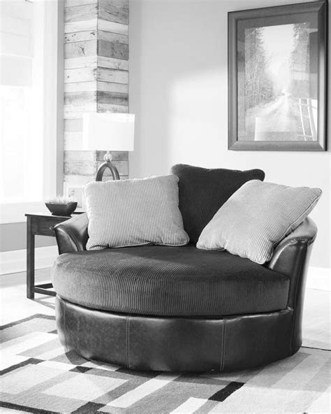 Luxurious swivel chair with brown faux leather and rich