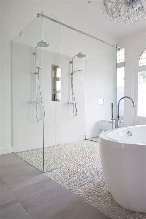 Bring the outdoors inside with a river rock floor in your bathroom. Bathroom Shower with River Rock Floor - Contemporary