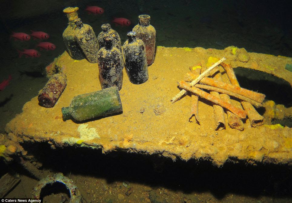 Creepy: The body of water was Japan's main base during World War Two, but in 1944, U.S. forces launched an attack. Above, an operating table lies beneath the water