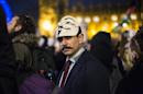 Anti-capitalist protesters wearing Guy Fawkes masks take part in the "Million Masks March" in Parliament Square in London on November 5, 2014