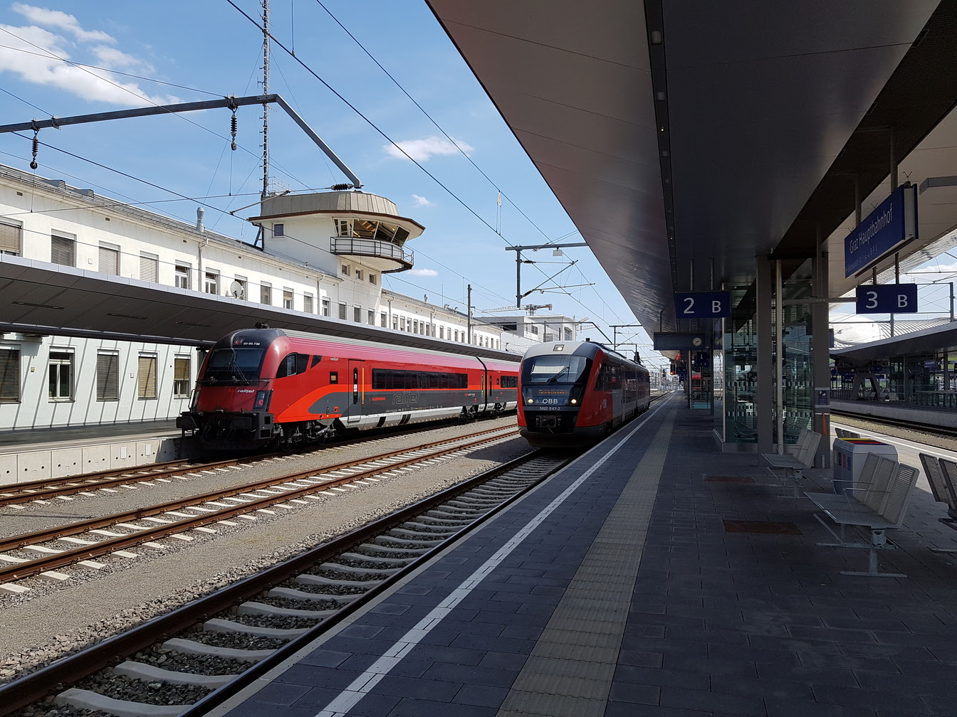 The cab-car end of a Railjet trainset in the Austrian colors at the Graz station.