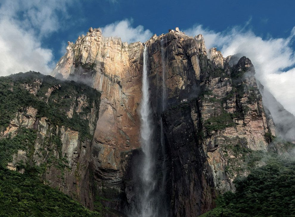 Angel Falls, Venezuela. With a plunge 15 times the height of Niagara Falls, Angel Falls streams from the tabletop mountain called Auyantepui. The site was named after Jimmy Angel, a U.S. aviator who was the first known person to fly over the falls. His ashes were scattered there in 1960. In addition to its undeniable beauty, you may notice that the area is similar to Paradise Falls from Disney’s Up, a clear inspiration for the movie. 