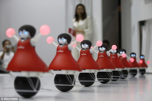 A group of 14-inch (36cm) tall cheerleader robots showcased their flawless choreography.Murata manufacturing, an electronic component manufacturer, presented the cheerleaders with colour-changing pom-poms that use gyroscopic sensors to roll on spherical bases in unison without losing their balance